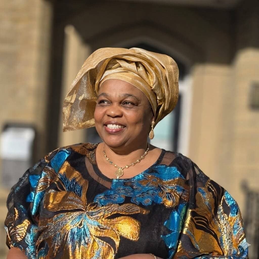 Portrait of founder Mrs. Nwugo Ugada smiling warmly.